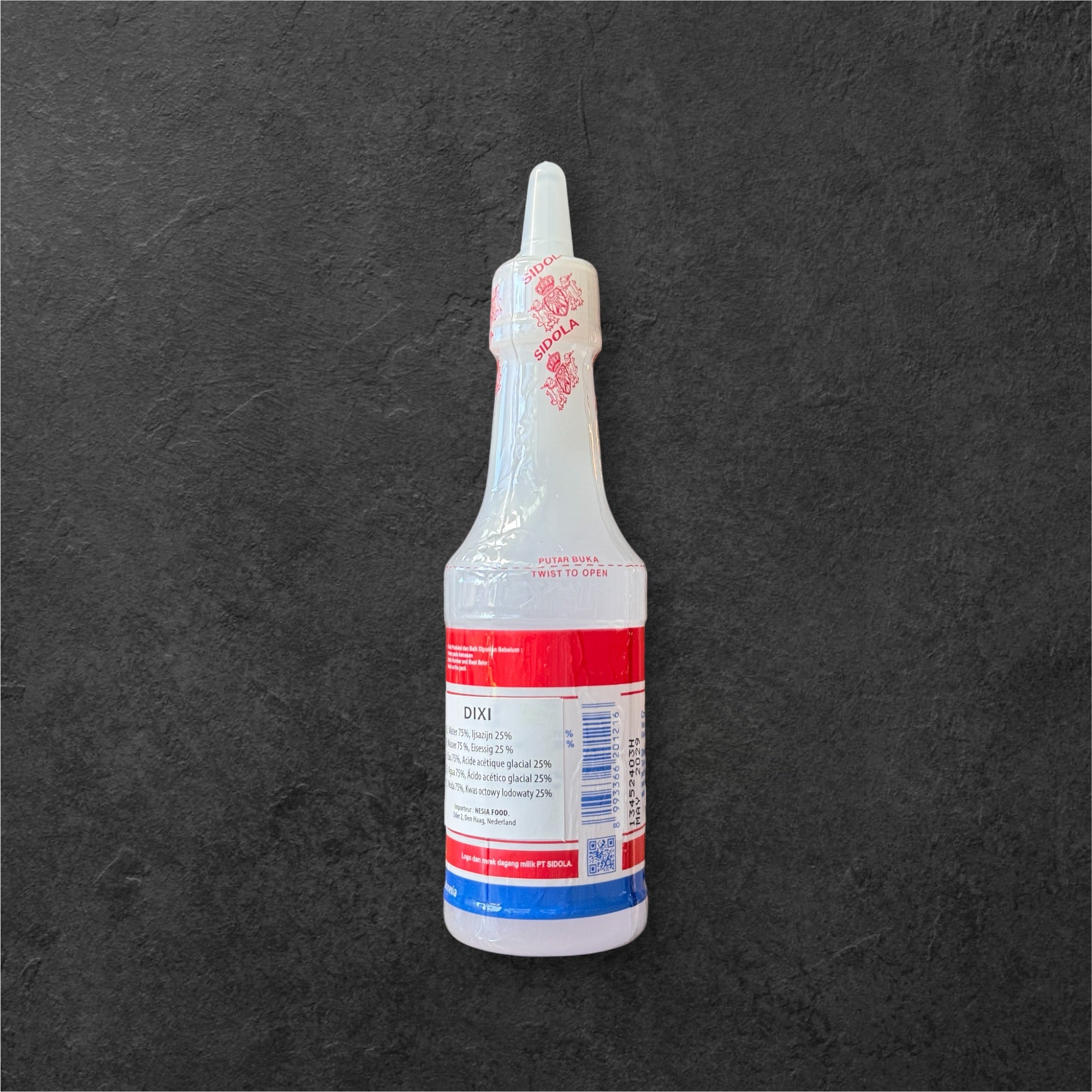 Dixi Essig von Nesia Food in einer Flasche, klar und braun, ideal zum Kochen und Würzen in der Küche
