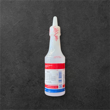 Dixi Essig von Nesia Food in einer Flasche, klar und braun, ideal zum Kochen und Würzen in der Küche